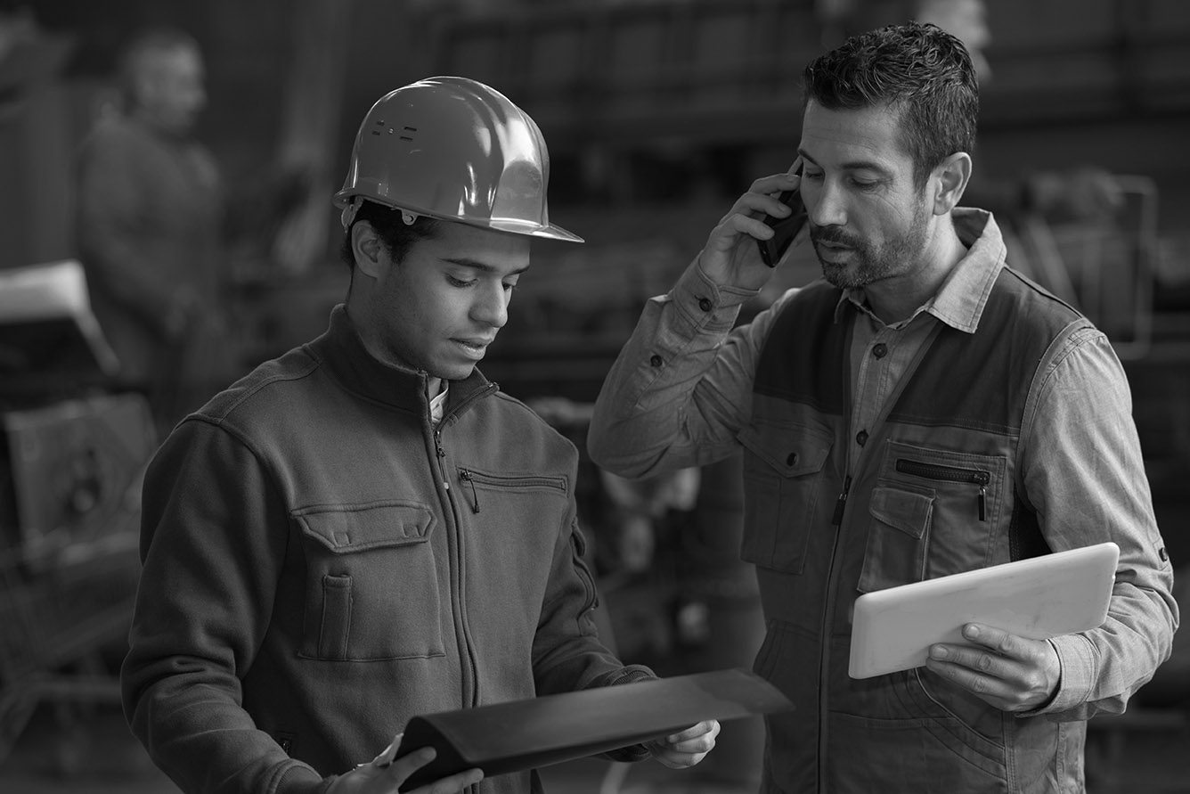 sawmill equipment operators checking status of sawmill equipment